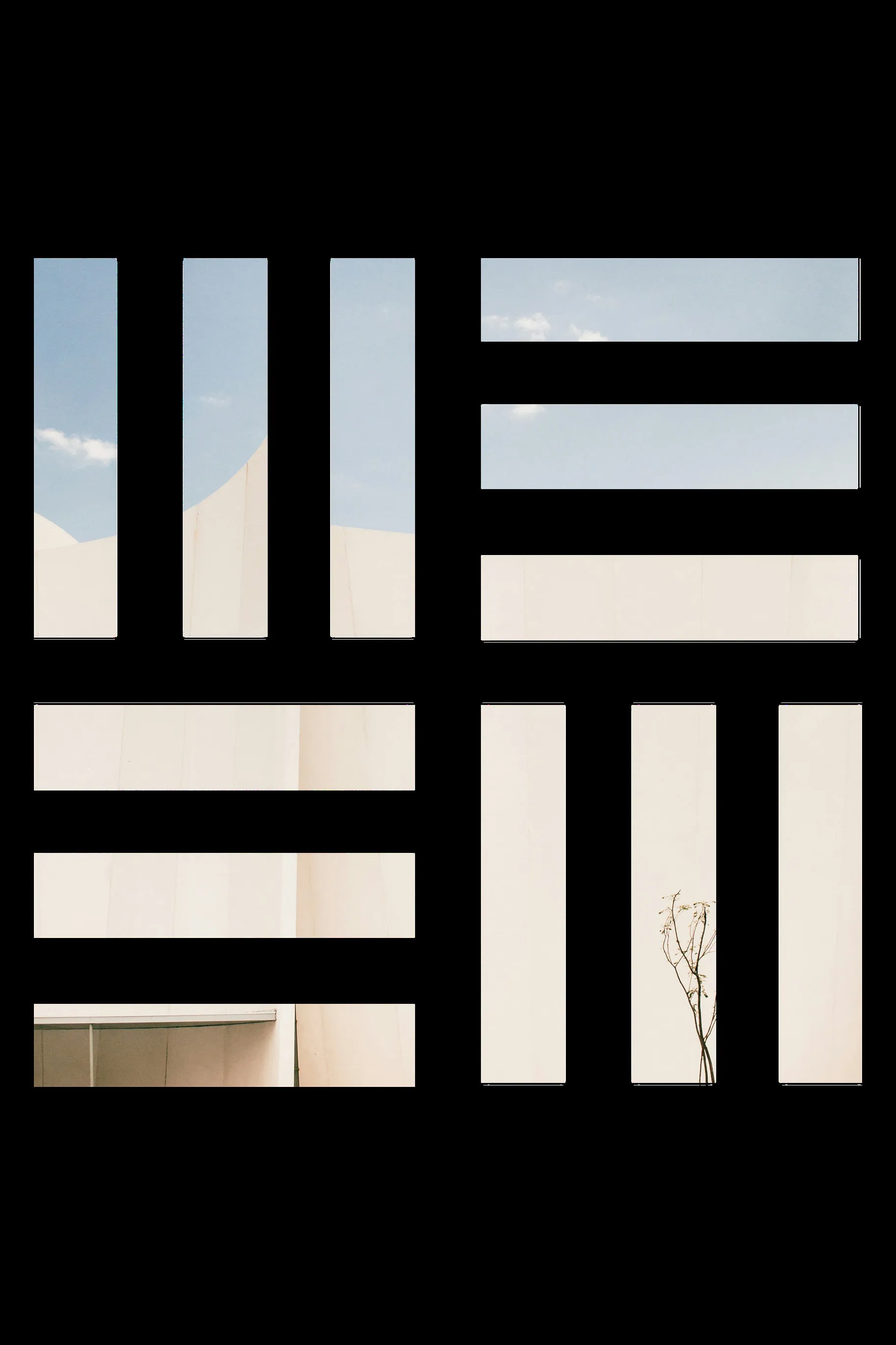 Sky and a pale facade seen through the openings of the Master Elite isotype